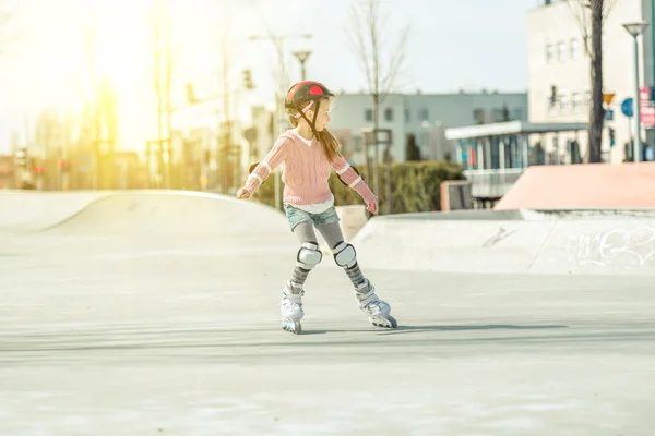 Little pretty girl on roller skates