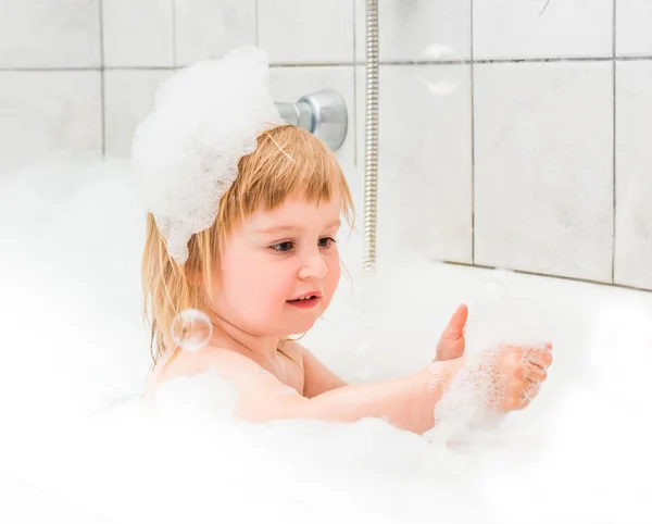 Cute two year old baby bathes