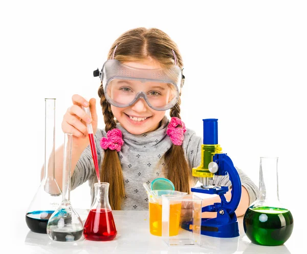 Little girl with flasks for chemistry