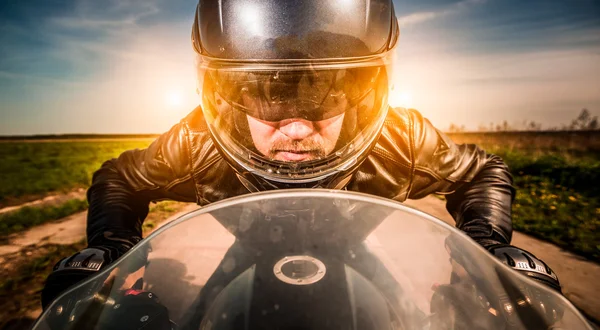 Biker racing on the road