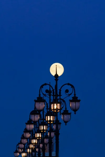 Street lamps and moon