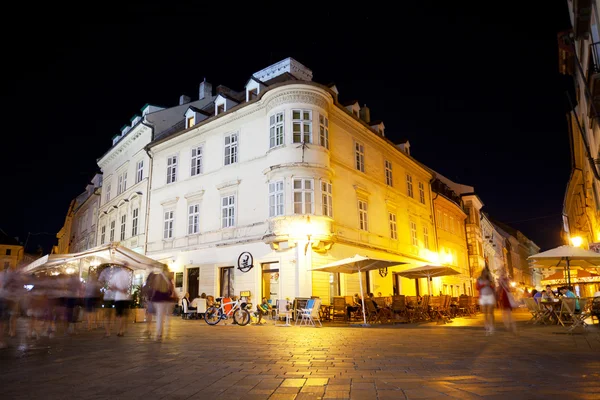 Tourists in evening city Bratislava