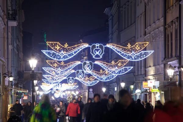 People on evening street of Krakow