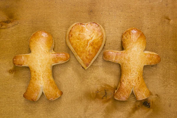 Cookies in the shape of a man and heart