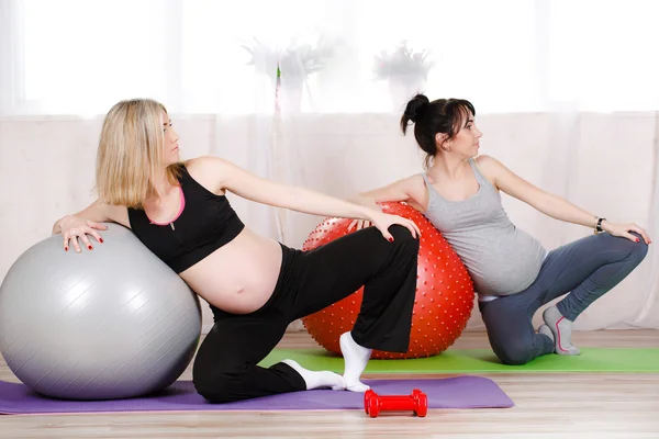 Pregnant women with large gymnastic balls