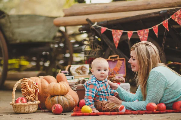 Mother and son playing in the yard of his house in the village