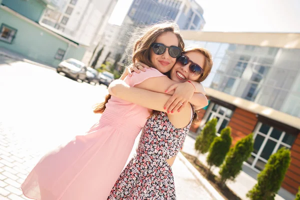 Two beautiful young women having fun in the city