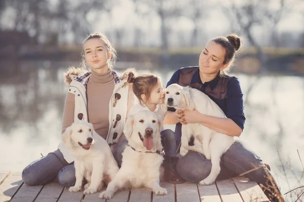 Happy family with Pets near the lake