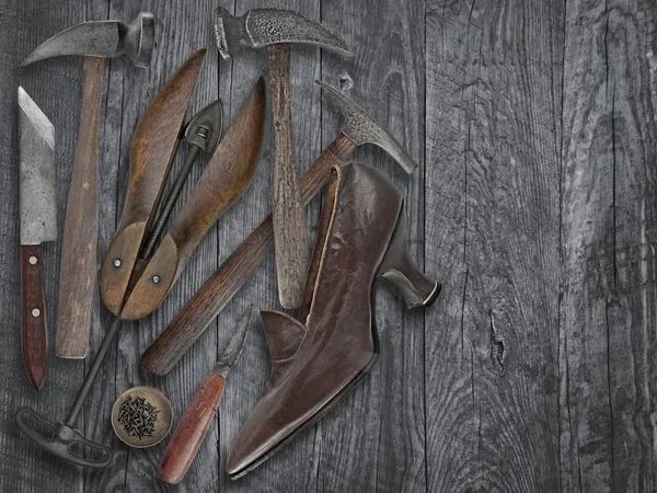 Vintage shoemakers tools and shoe