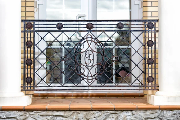 Ornate balcony of wrought iron