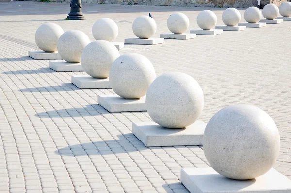 Protection in the form of decorative stone spheres