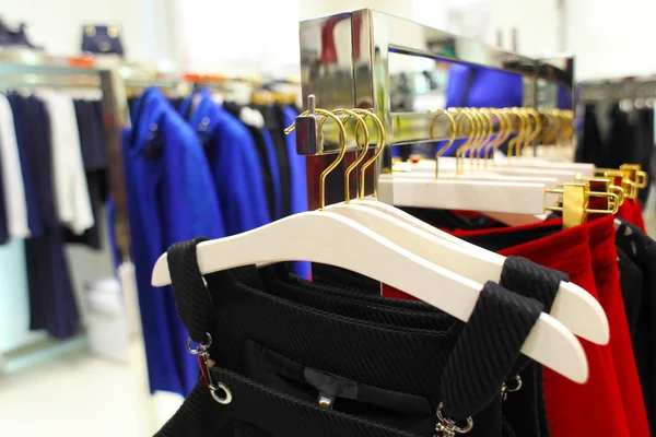 Female clothes on hangers in store