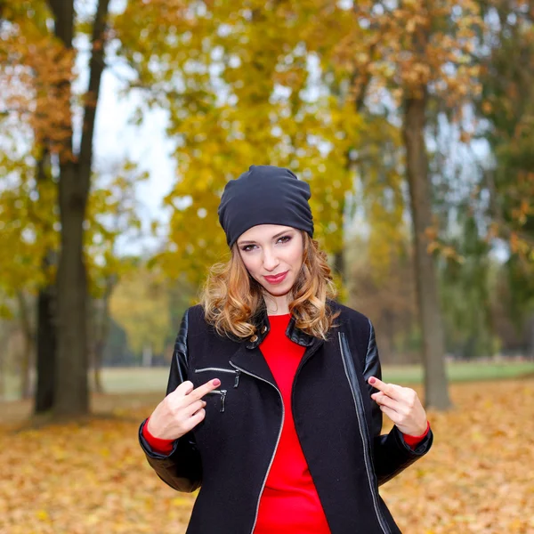 Girl showing obscene gestures outdoor