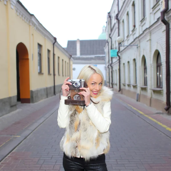 Hipster girl with vintage camera