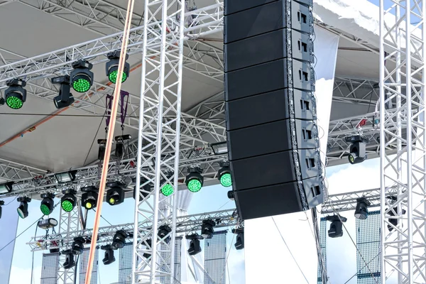 Outdoor stage with lighting and sound equipment