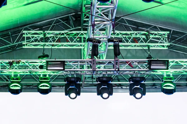 Row of spotlights under roof of outdoor stage