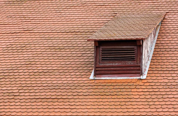 Dormer window and red roof tiles