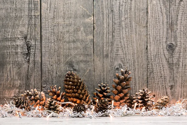 Christmas decoration with lights and pine cone