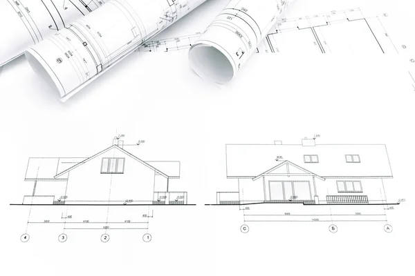 Rolls of blueprints for house construction