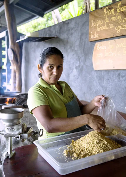 Woman prepares from corn flour tortillas