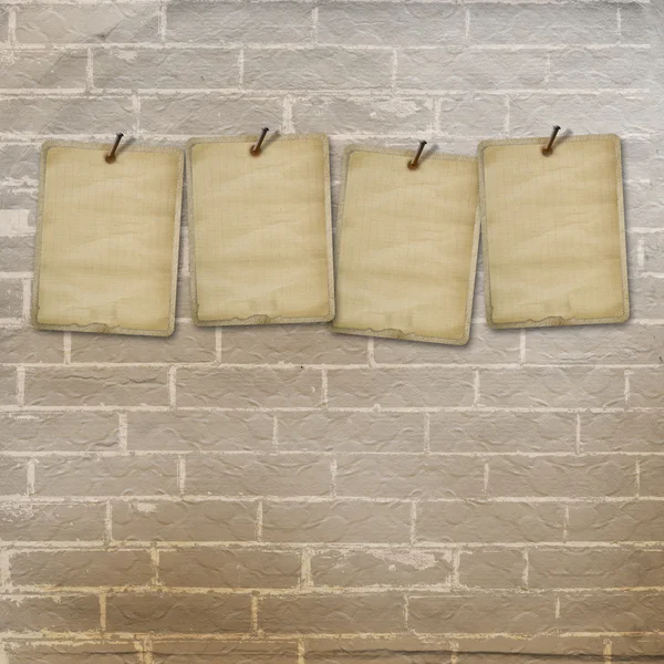 Old vintage sheets for advertisements on brick wall