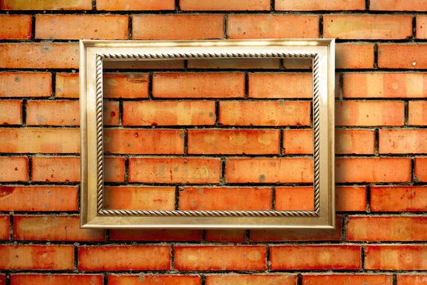 Vintage wooden frames for pictures on old brick wall