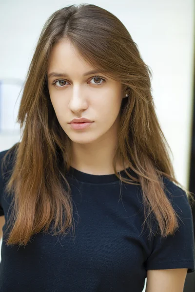 Close up of young beautiful woman in black dress