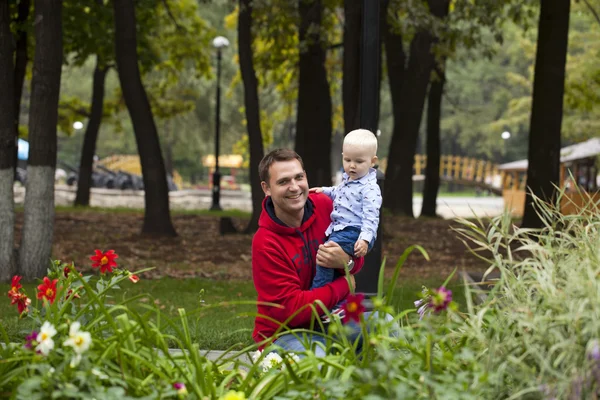 Father with two year old son in summer park