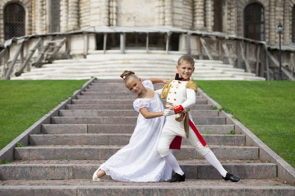 Childrens ballroom dance couple in suits