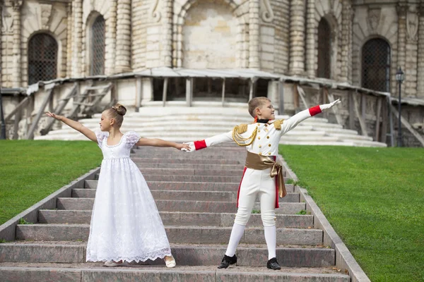 Childrens ballroom dance couple in suits