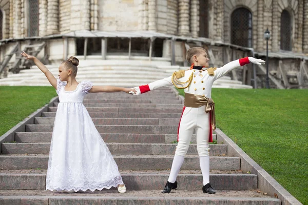 Childrens ballroom dance couple in suits