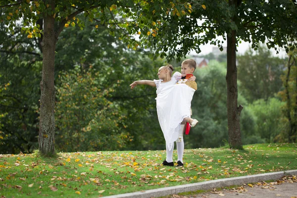 Childrens ballroom dance couple in suits