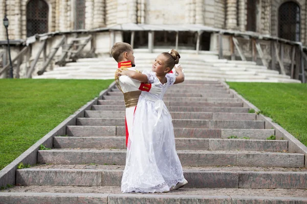 Childrens ballroom dance couple in suits