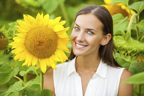Happy woman with sunflowers