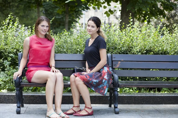 Young woman resting on a bench in the park