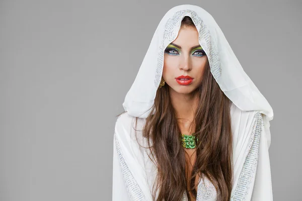 Portrait of the young sexy woman in white tunic Arabic