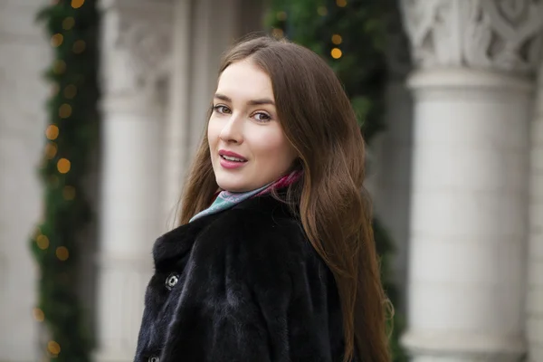 Young beautiful woman in stylish mink coat