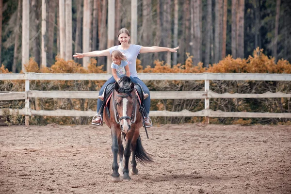 Mom and child  on the horse