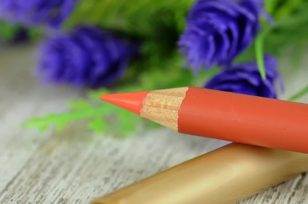 Orange lip pencil with flowers