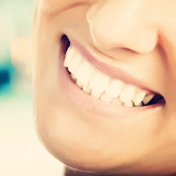 Close up of woman\'s teeth and lips