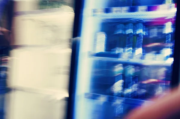 Beverage on fridges shelves in a supermarket