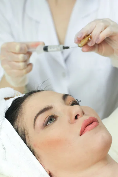 Woman Having Botox Treatment At Beauty Clinic