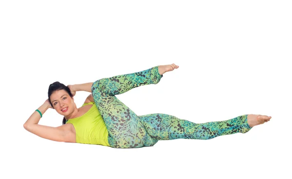Young woman practicing yoga, lying on back with feet up variatio