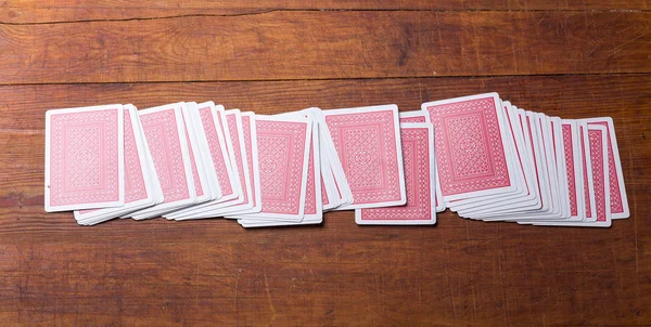 Deck of cards on wooden table