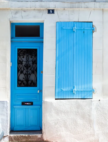 Blue painted door and window