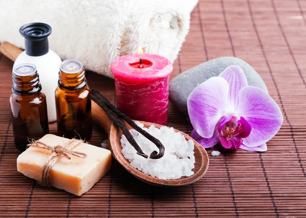 Spa still life with vanilla pods, hand made soap and aroma oils