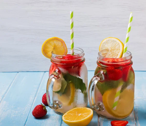 Strawberry detox water in glass jars