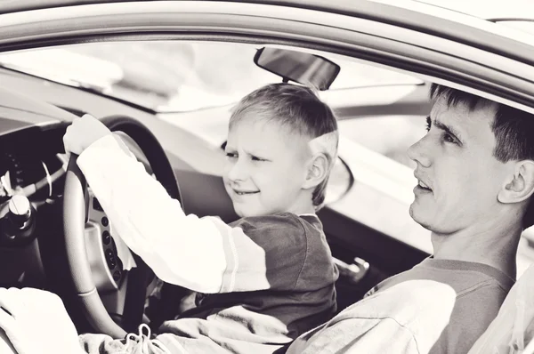 Father and son  in a car