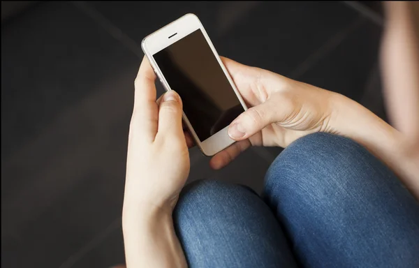 Female hands with mobile phone