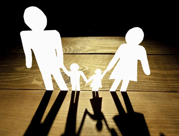 Paper family with black shadows